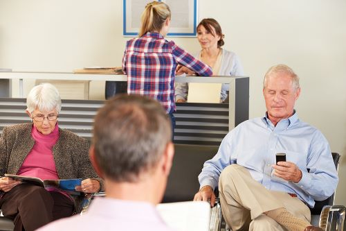 Patients are sitting in a doctor's waiting room.