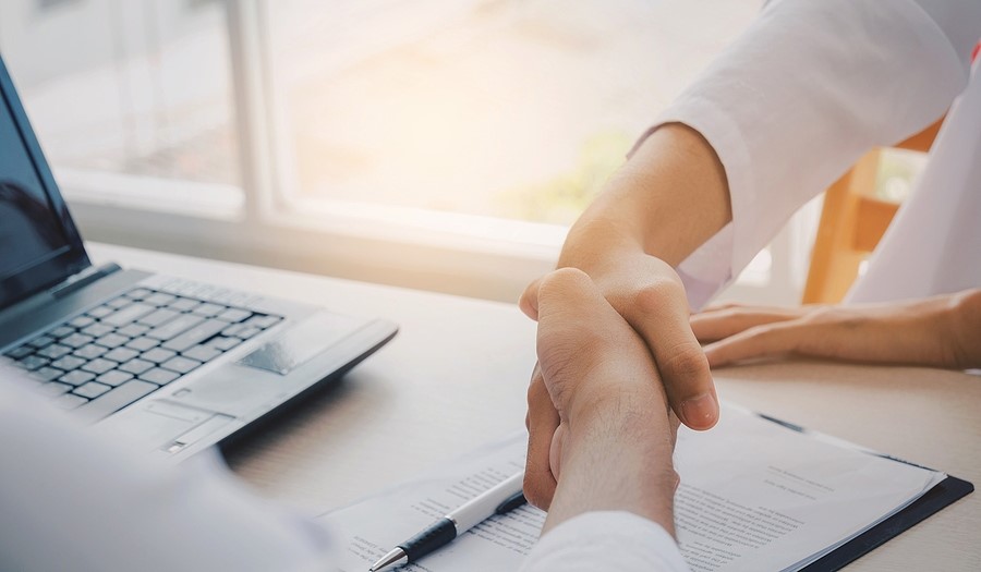 DataSafe clients shaking hands for Technology Escrow Services in Portland OR