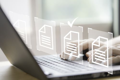 Hand using laptop computer with virtual screen and document for paperless online approval