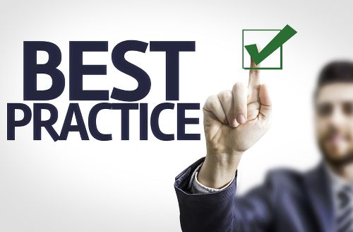 Business man pointing to transparent board with text: Best Practice