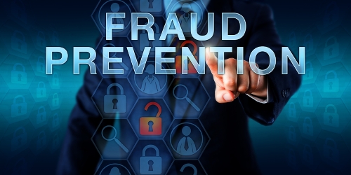 Forensic examiner is pushing FRAUD PREVENTION on a virtual screen.