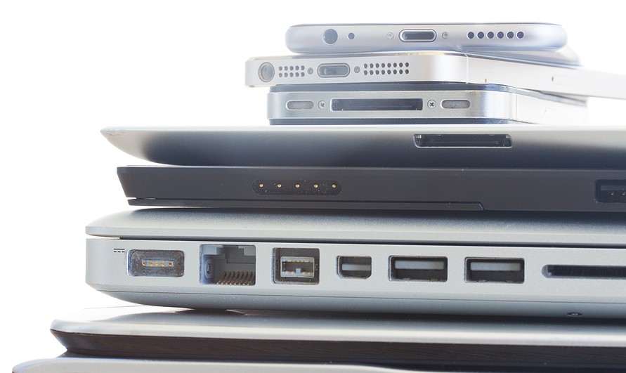 A stack of electronic devices ready for media destruction